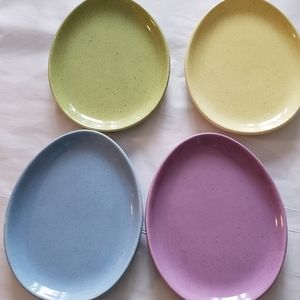 4 Williams Sonoma speckled egg shaped plates